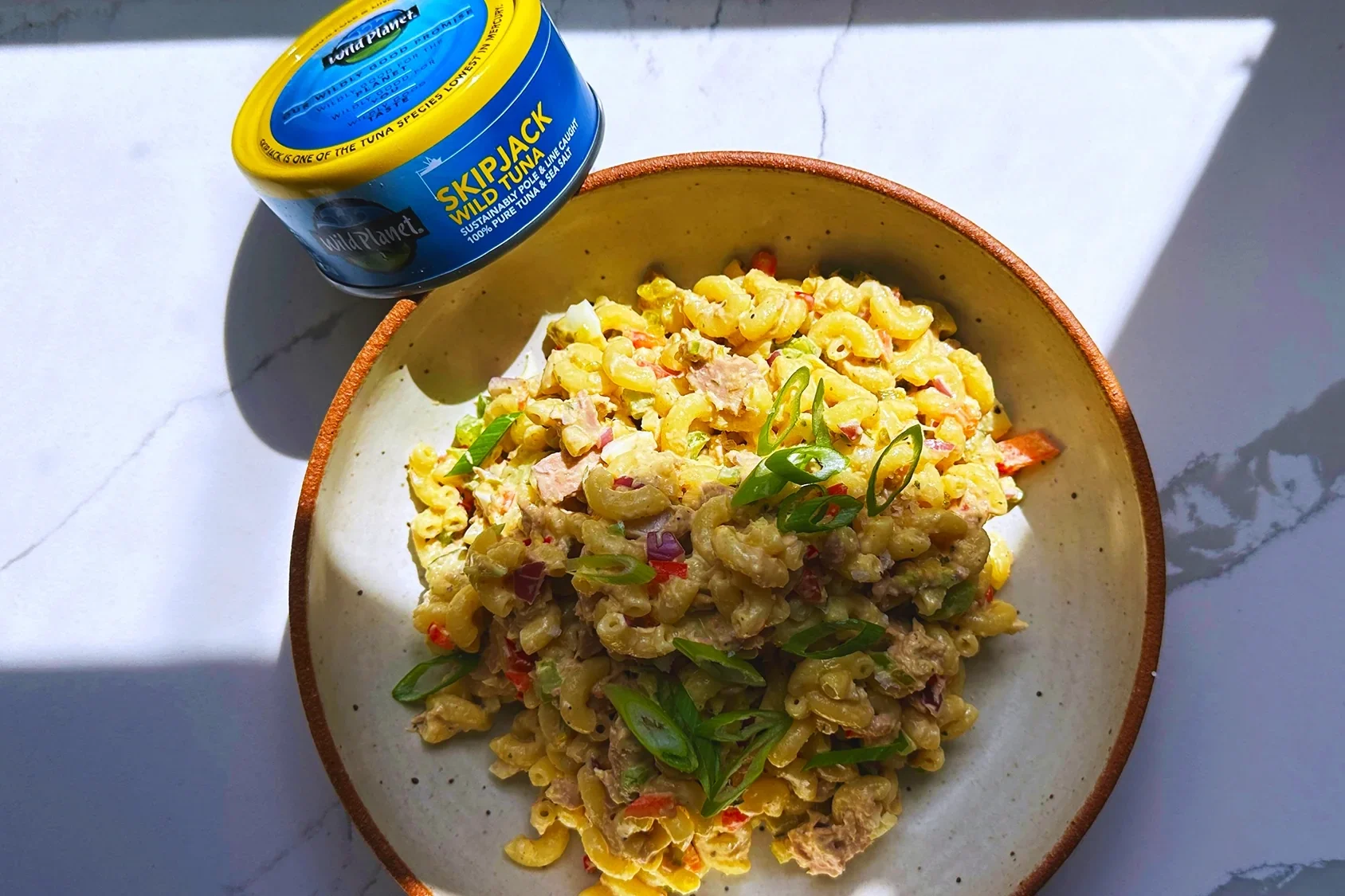wild planet skipjack wild tuna can with tuna pasta on a plate