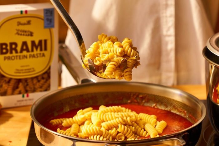 High fiber pasta "brami" being scooped out of a frying pan.