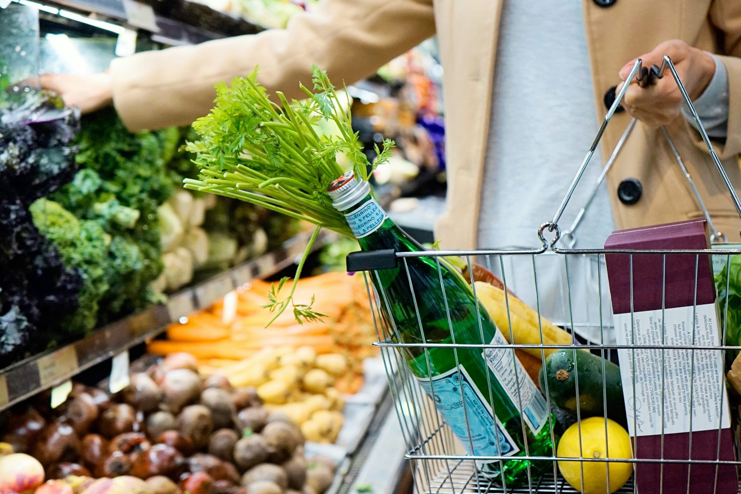 woman grocery shopping for healthy groceries for  spring pantry detox